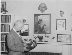 Frank Rand looking at a mask