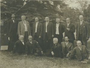 Twelve men from the class of 1876 under class tree