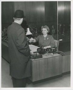 Mrs. Frances Marsala seated in her wheelchair working as a receptionist