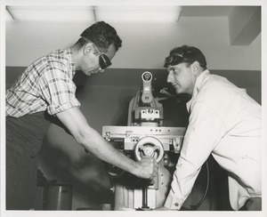 Two men in machine shop