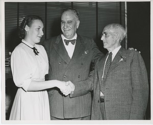 Colonel John N. Smith with retiring employee and unidentified woman