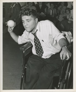 Man in wheelchair with baseball