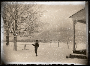 Boy in falling snow (Greenwich, Mass.)