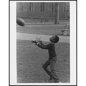 Child catching football at Hyde Park branch