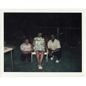 Stephen, Laymon, and Inez Irving Hunter pose in the yard at night
