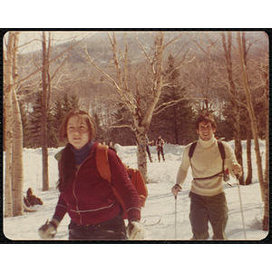 Diane Walsh (foreground) and a teenage boy cross-country ski