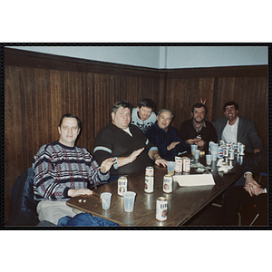 Six Bunker Hillbilly alumni sit a table during a reunion event