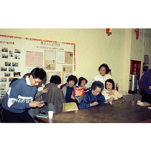 Audience donating money at a meeting between Mexican workers and the Chinese Progressive Association