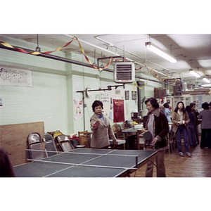 Players at Chinese Progressive Association International Women's Day ping-pong tournament