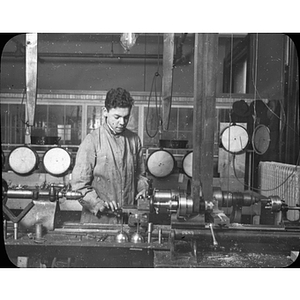 Engineering co-op student works on a machine at Sanborn Engineering Co