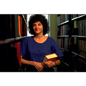 Lucy Williams, a professor from the School of Law, standing in the stacks of the Law Library