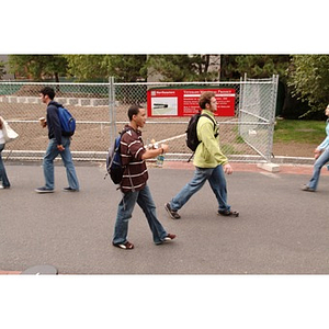 Odalis David Polanco walks past construction on campus