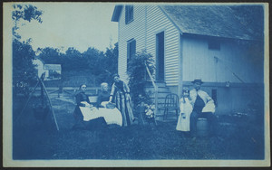 Group of people sitting in the backyard of a house, Worcester, Mass., 1887