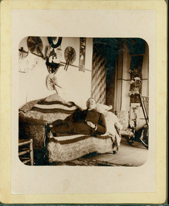 Unidentified man reclining on sofa, Piazza, Castle Tucker, Wiscasset, Maine, undated