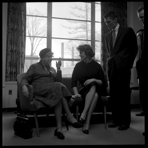 Eleanor Roosevelt (left) seated in the Cape Cod Lounge (Student Union), in conversation with Gail Osbaldeston ('61, seated) and Donald Croteau ('61), during Roosevelt's Distinguished Visitors Program appearance at UMass Amherst