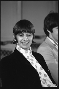 Ringo Starr grinning broadly during a Beatles press conference