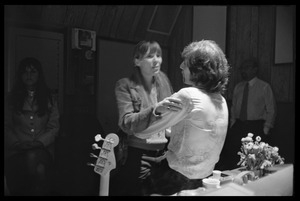 Joni Mitchell embracing Graham Nash during production of the first Crosby, Stills, and Nash album
