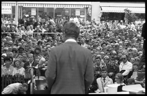 View from rear stage of Robert F. Kennedy speaking to a large crowd at the Turkey Day festivities