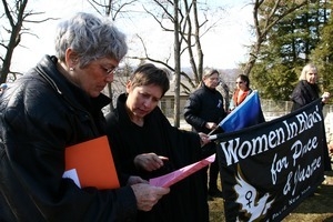 Women protesters with banner 'Women in Black for Peace and Justice': rally and march against the Iraq War
