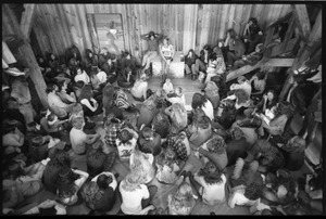 Michael Metelica addressing a crowd of commune members at a meeting inside the Brotherhood of the Spirit dormitory, Warwick, Mass. (view from above, front)