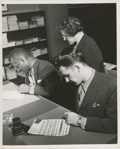 Johanna Olchewsky teaching left-hand writing to ICD clients Benjamin Barnette and John Kelly