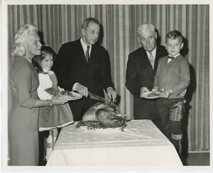 Staff with young clients at Thanksgiving dinner