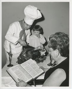 Chef Michael Malone and Leslee Trimble with turkey and woman reading bible