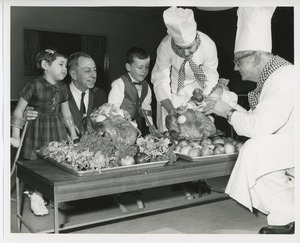 Mr. Burrows and young clients with chefs and turkeys