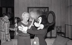 Woman with Disney character Mickey Mouse