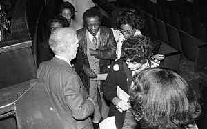 Mayor Kevin H. White speaking with a group of people at the Strand Theatre