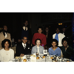 Attendees of a banquet posing for a group photo