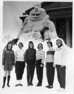 Winter Carnival Queen Carol Starke and others in front of King Winter, 1958