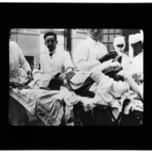 Doctors operating on a patient in the operating room