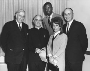 Suffolk University President John E. Fenton (1965-1970) with Father Egan and others at a campus event