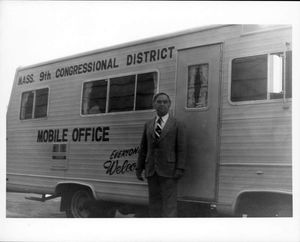 Congressman John Joseph Moakley standing in front of his mobile District office van, 1970s