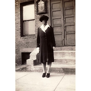 Lillian Irish stands in front of St. Michael and All Saints Church on Ruggles Street