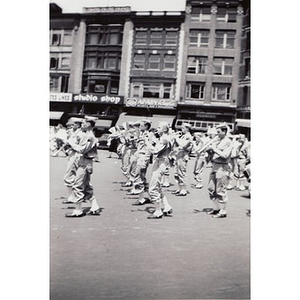 A marching band from an unknown school participates in the Boston School Boy Cadets parade