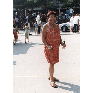 Portrait of a woman in an orange dress at Festival Betances.