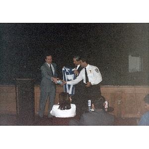 Presenting of gifts or awards at an event at the Jorge Hernandez Cultural Center.