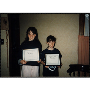 Lori and Sharon Burke display their awards at a Boys & Girls Club awards event