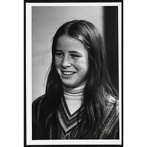 A smiling girl with long hair from the Boys' Clubs of Boston