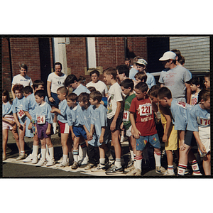 Children gather at the start line of the Battle of Bunker Hill Road Race