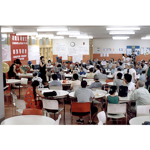 Suzanne Lee speaks to a crowded room of people during a Chinese Resident Association celebration