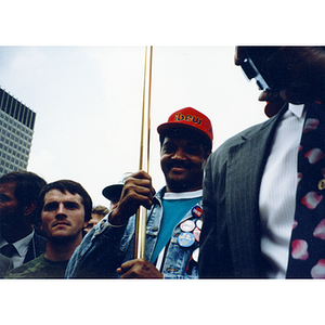 Jesse Jackson, the leader of the Rainbow Coalition, holding the ...