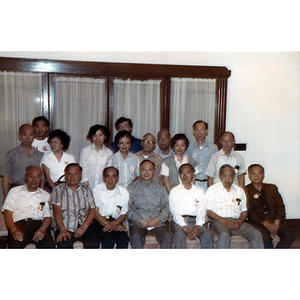 Men and women sit together in a group