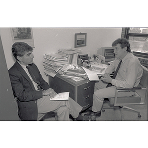 Former Massachusetts Governor Michael Dukakis, left, meets with Political Science Department professor Bruce Wallin