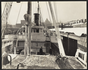 Indian, docked in Boston, covered with ice