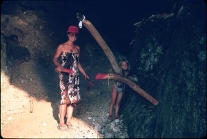 Sandi Sommmer and Katy holding phallic carvings in fertility cave, Princess Cove