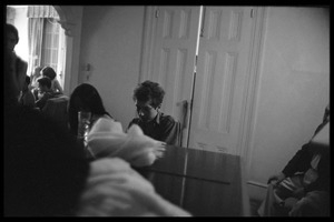 Bob Dylan, seated as a piano with Joan Baez backstage, Newport Folk Festival