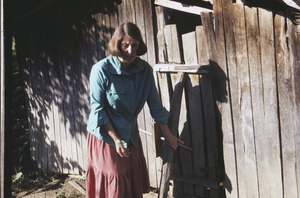 Barbara Halpern closes animal shed door